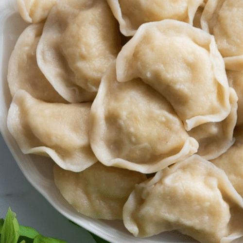 Pierogi z kapustą i pieczarkami